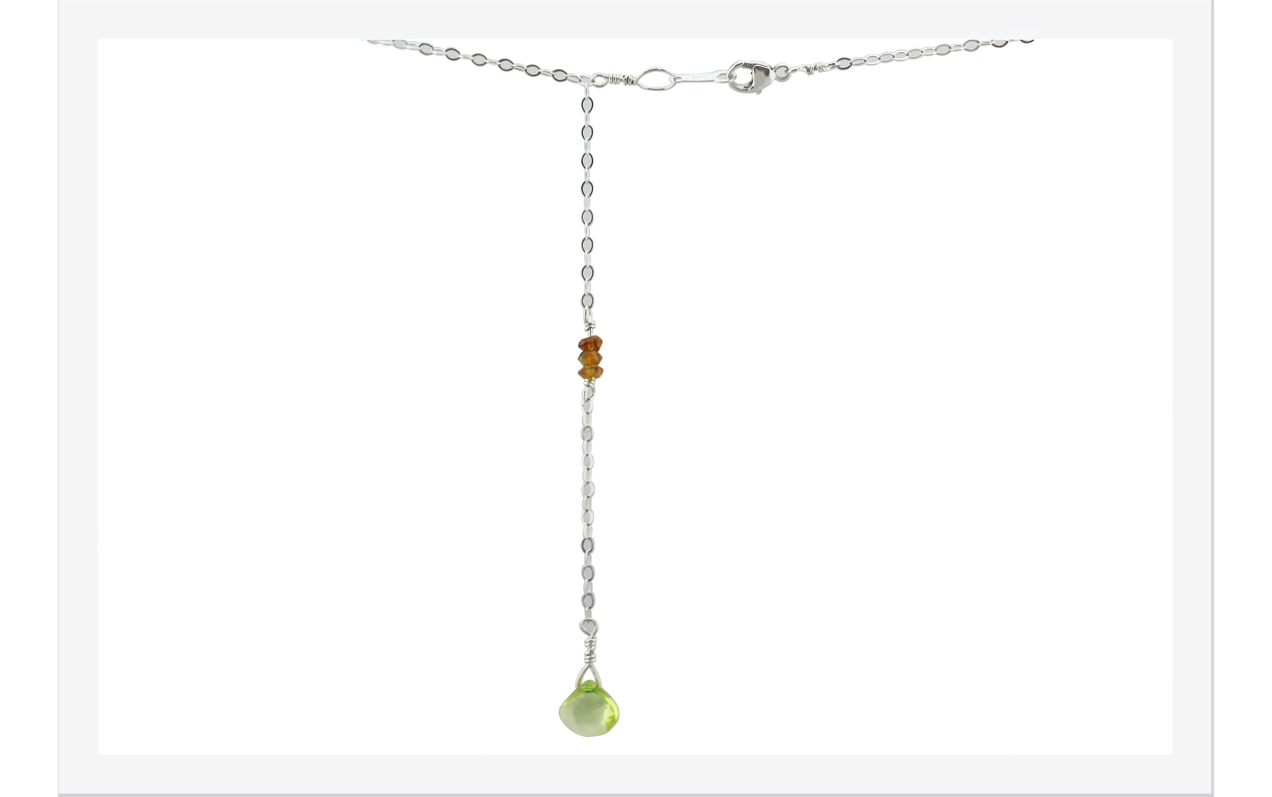 display of back drop necklace with peridot