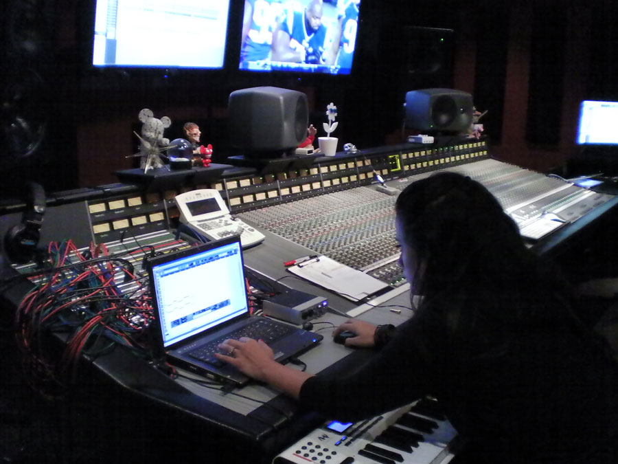 Christina laying synth tracks at Tommy Lee's Atrium Studios 