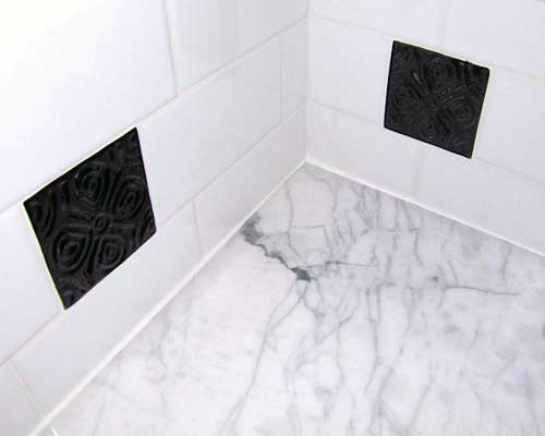 Art tiles interspersed with commercial tiles