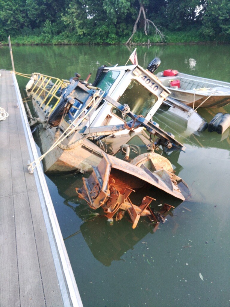 Image of sunken dredge barge being recovered by Carrier marine Services.