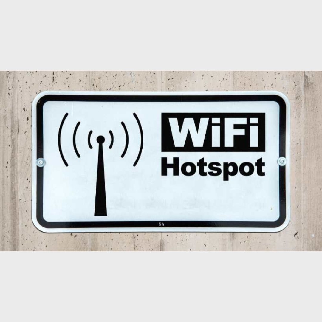 WiFi hotspot sign providing connectivity for text message sharing at events.