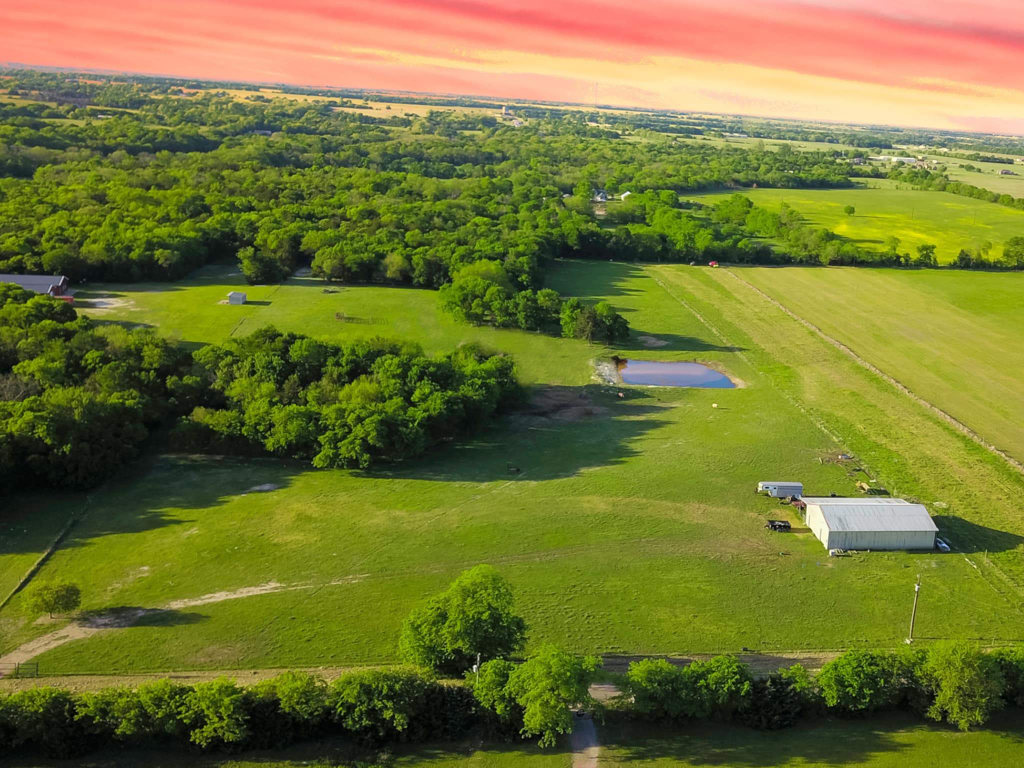 14.4 acres in a scenic and serene setting with a barn, pond and more.