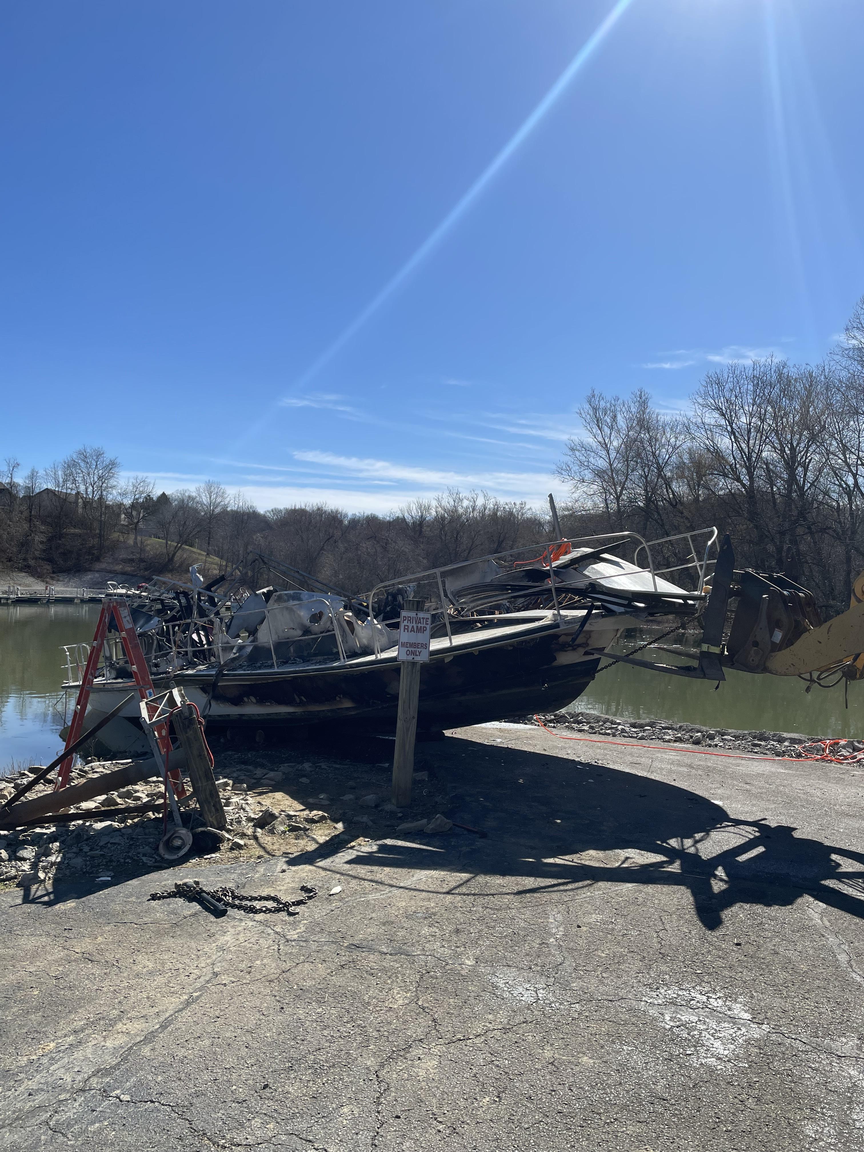 Vessel resting on the bank of the boat ramp in wait for investigation and demolition.