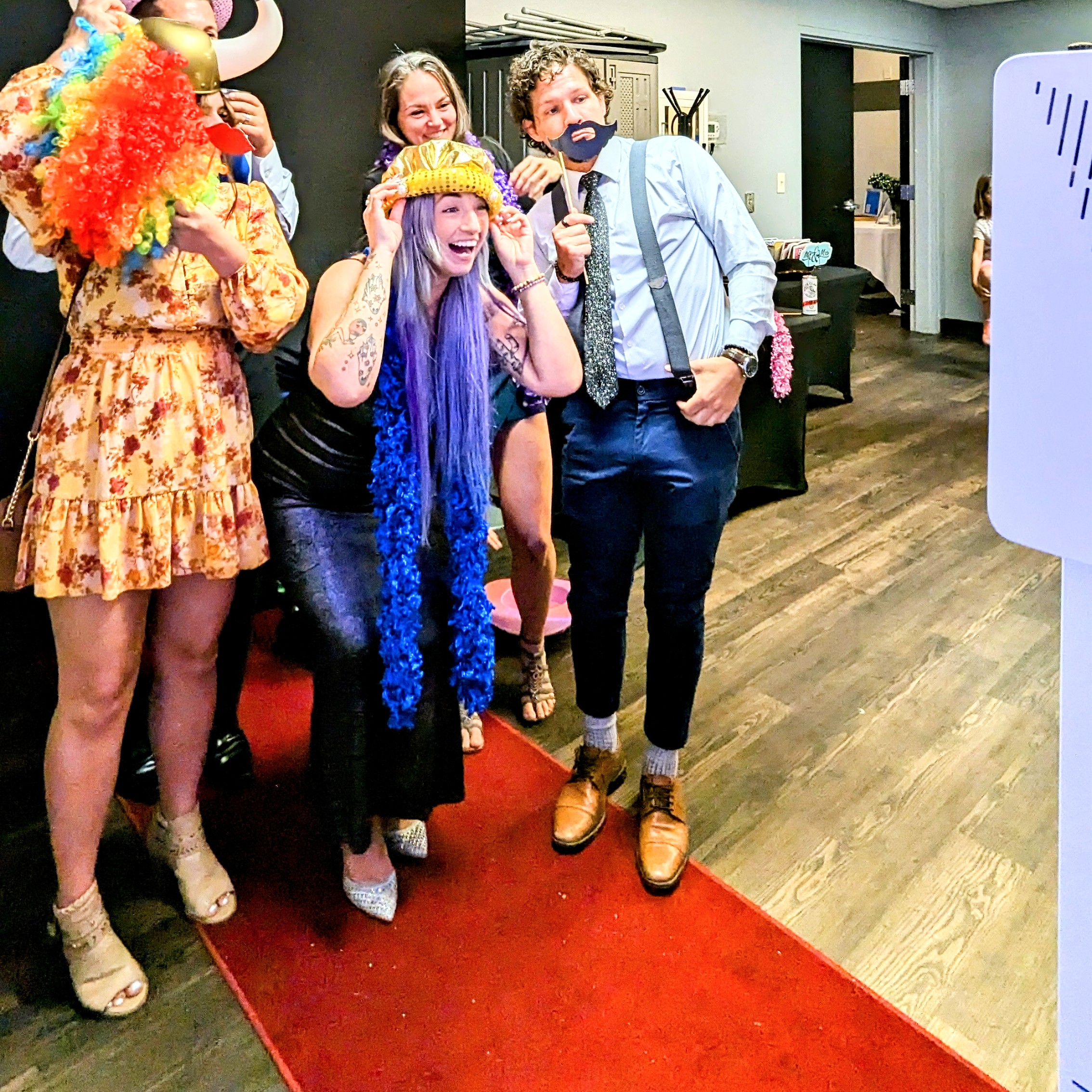 Epic photo booth fun at a lively party. Friends in colorful costumes capture the joy of celebrations