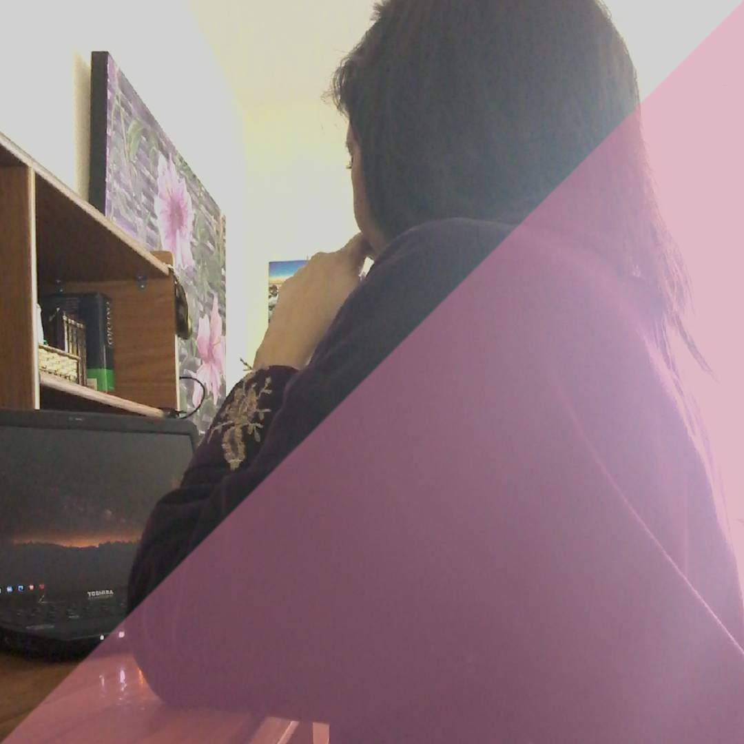 Picture of Christina at sitting at a desk with laptop