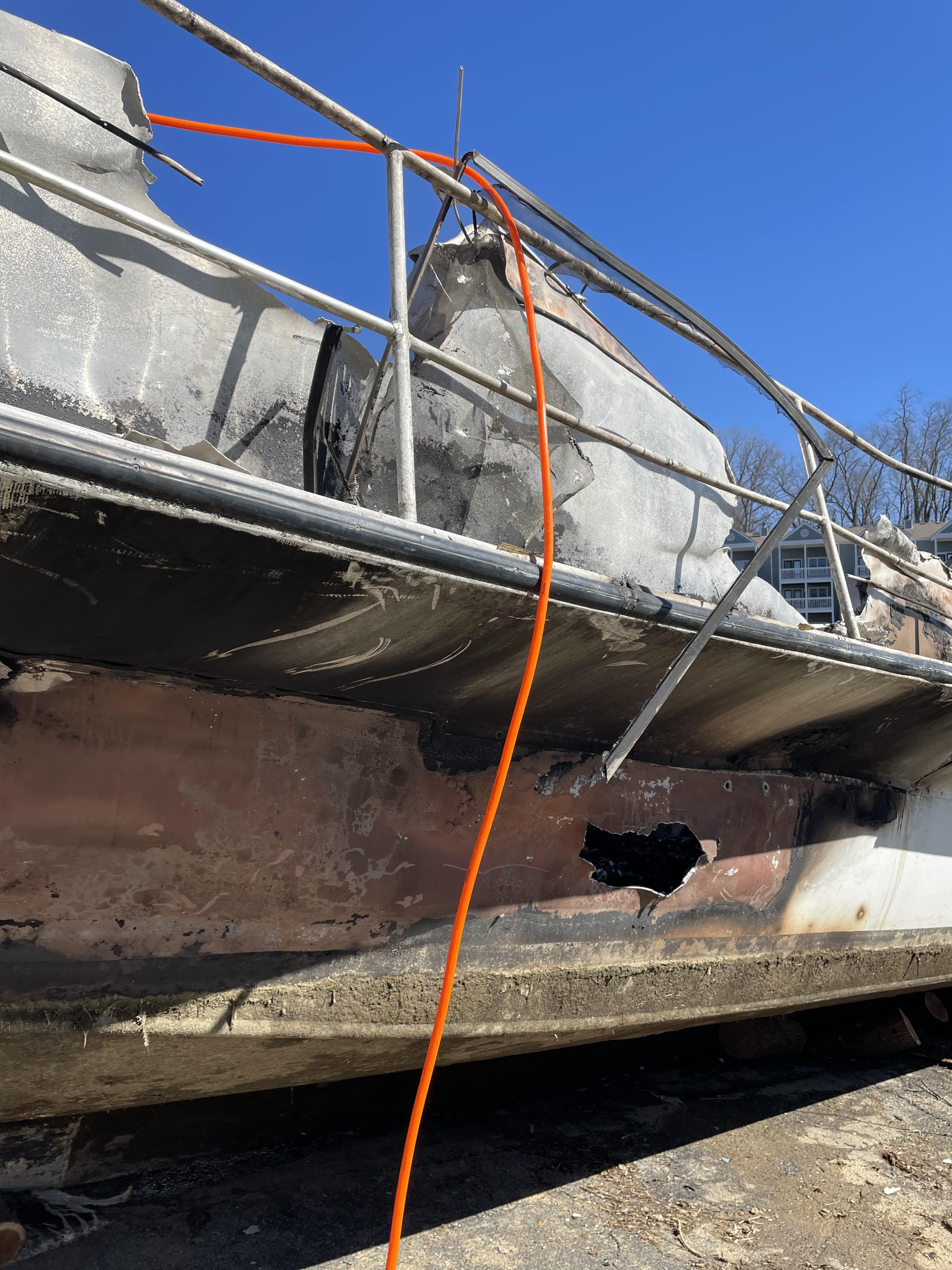 Melted aluminum hull from fire on houseboat.