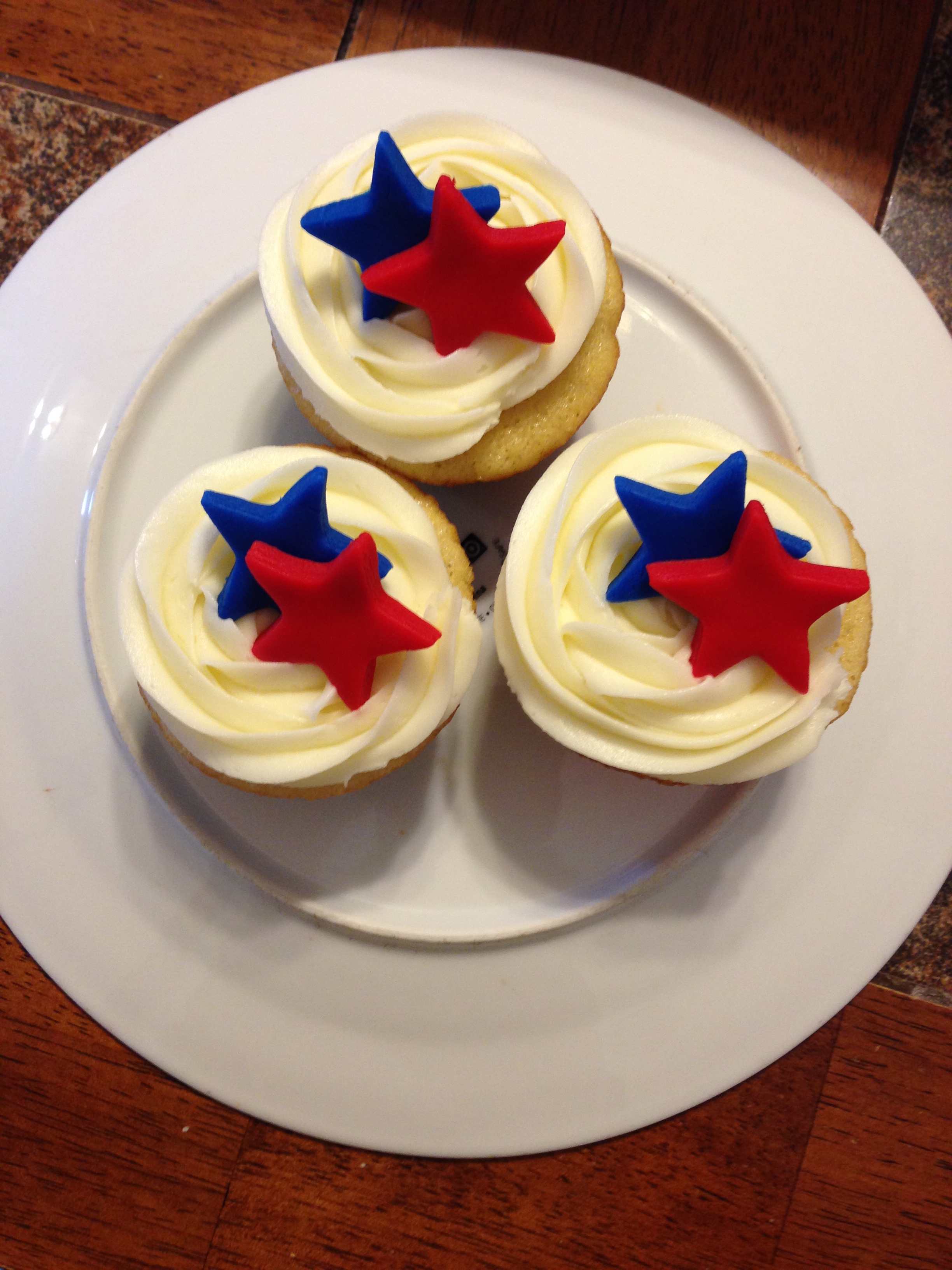 White Cupcakes w/ vanilla buttercream, handcut fondant stars, National Guard theme