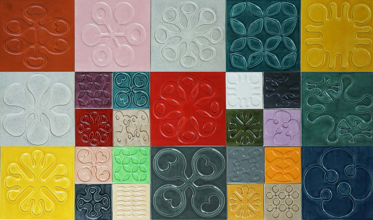 Collage of glazed art tiles in color and size variations